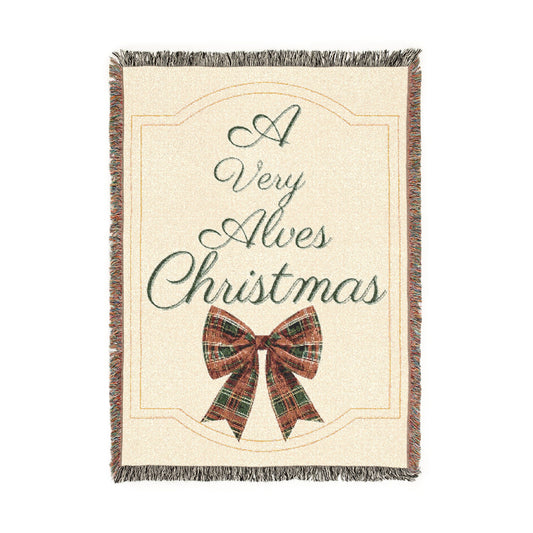 Decorative throw blanket with a plaid bow and 'Merry Christmas' text on a white background